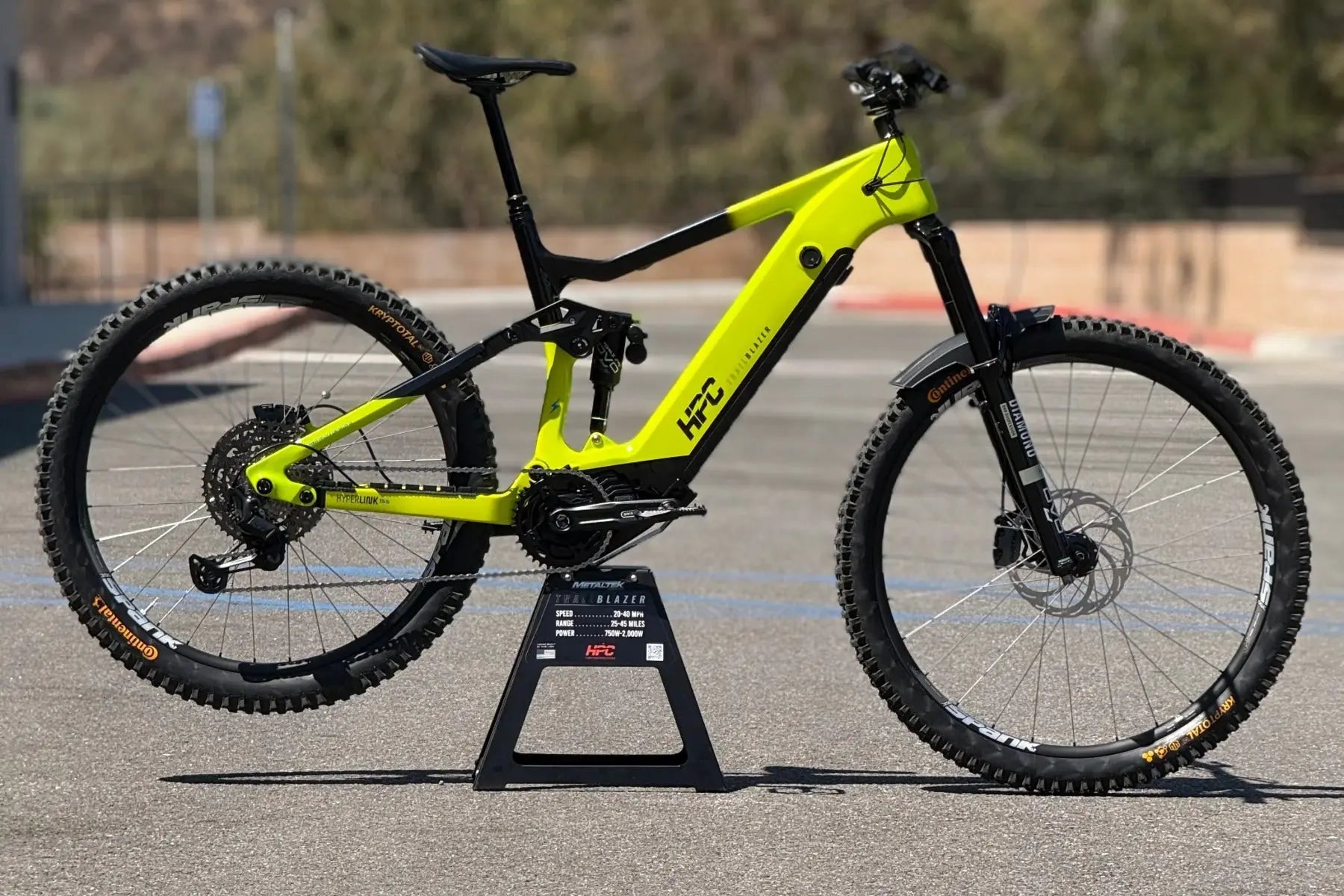 HPC Trailblazer custom build in neon yellow and black, full side profile centered on a display stand